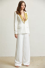 Blazer col pailleté doré