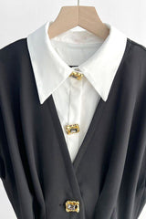 Robe boutonnée ornée de bijoux en cristal.